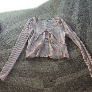 Super cute long sleeve top. you tie bows in the front!